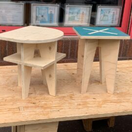 2 adapted Atocha plywood stools photographed outside on a table top